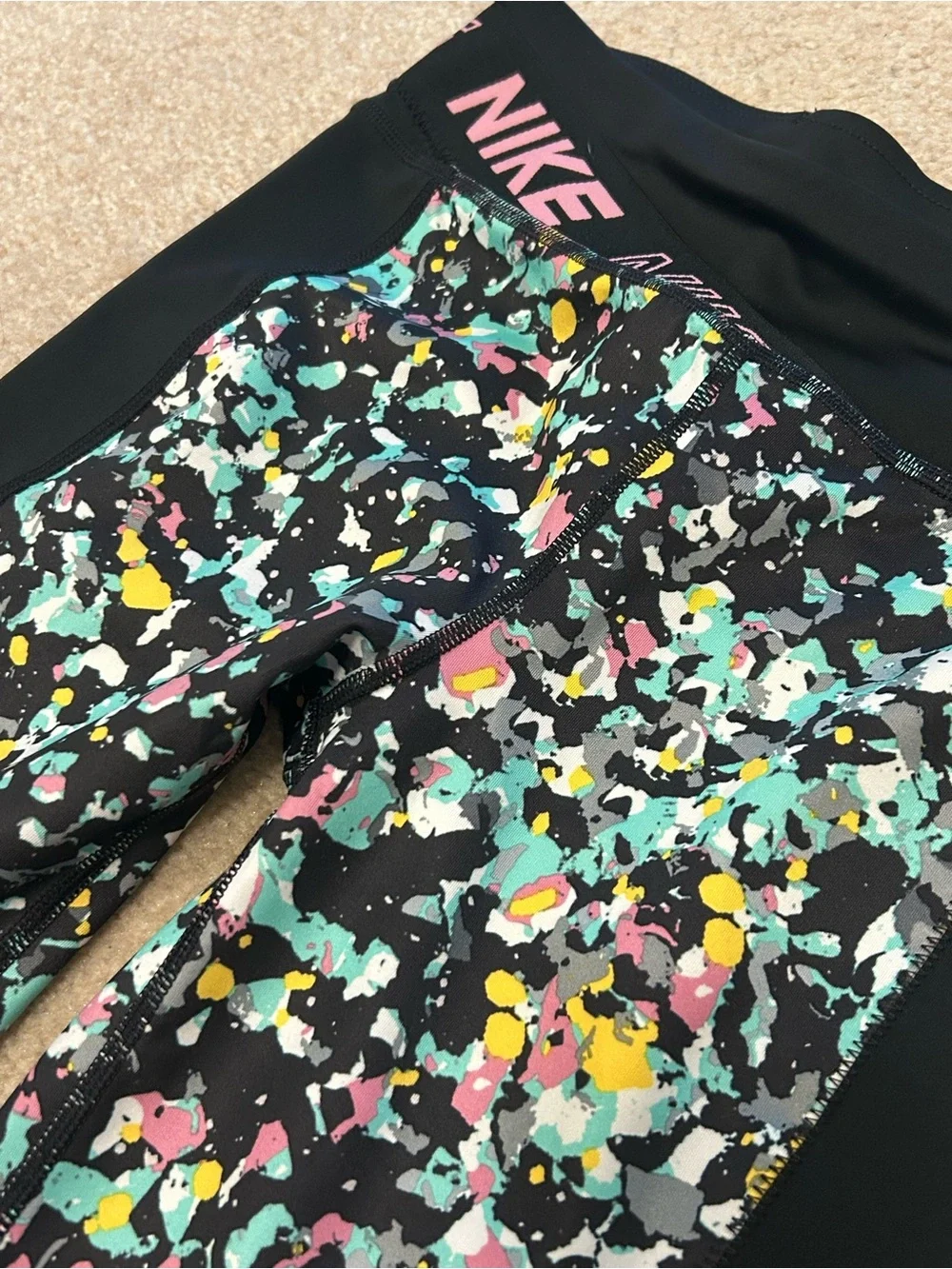 Nike Black Leggings with Multicolor Splash Print and Pink Logo
